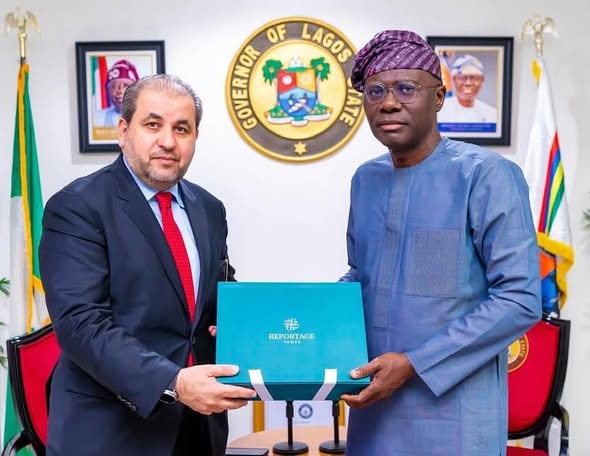 Reportage Group chairman presenting the Reportage Tower project pack to the Governor of Lagos State